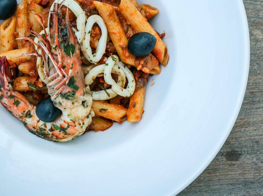 Seafood in red sauce pasta